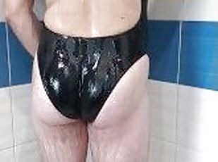 Boy wearing sexy realise Black swimsuit and get shower
