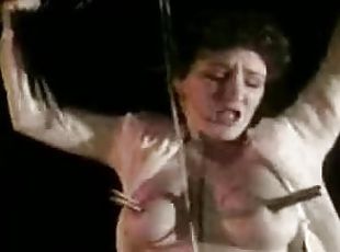 Brunette milf gets tied up and  tortured in vintage BDSM clip