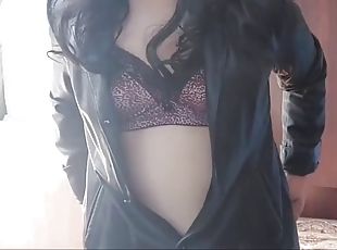 Shemale Kitty in leather coat, sunglasses and sexy bra with natural tits, hot