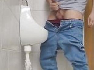 Risky jerk in public urinal at work