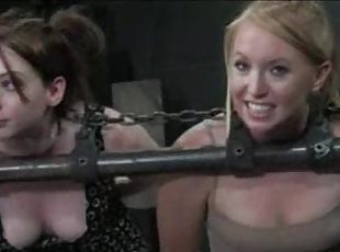 Three chained girls are lightly caned