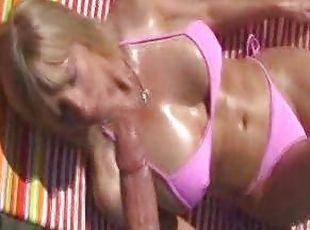 Big tits mom in pink bikini gives handjob